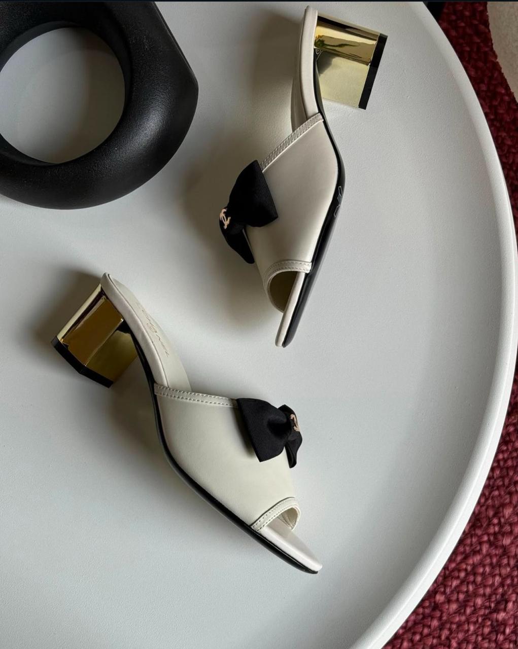 C-h-a-n-e-l bow heel