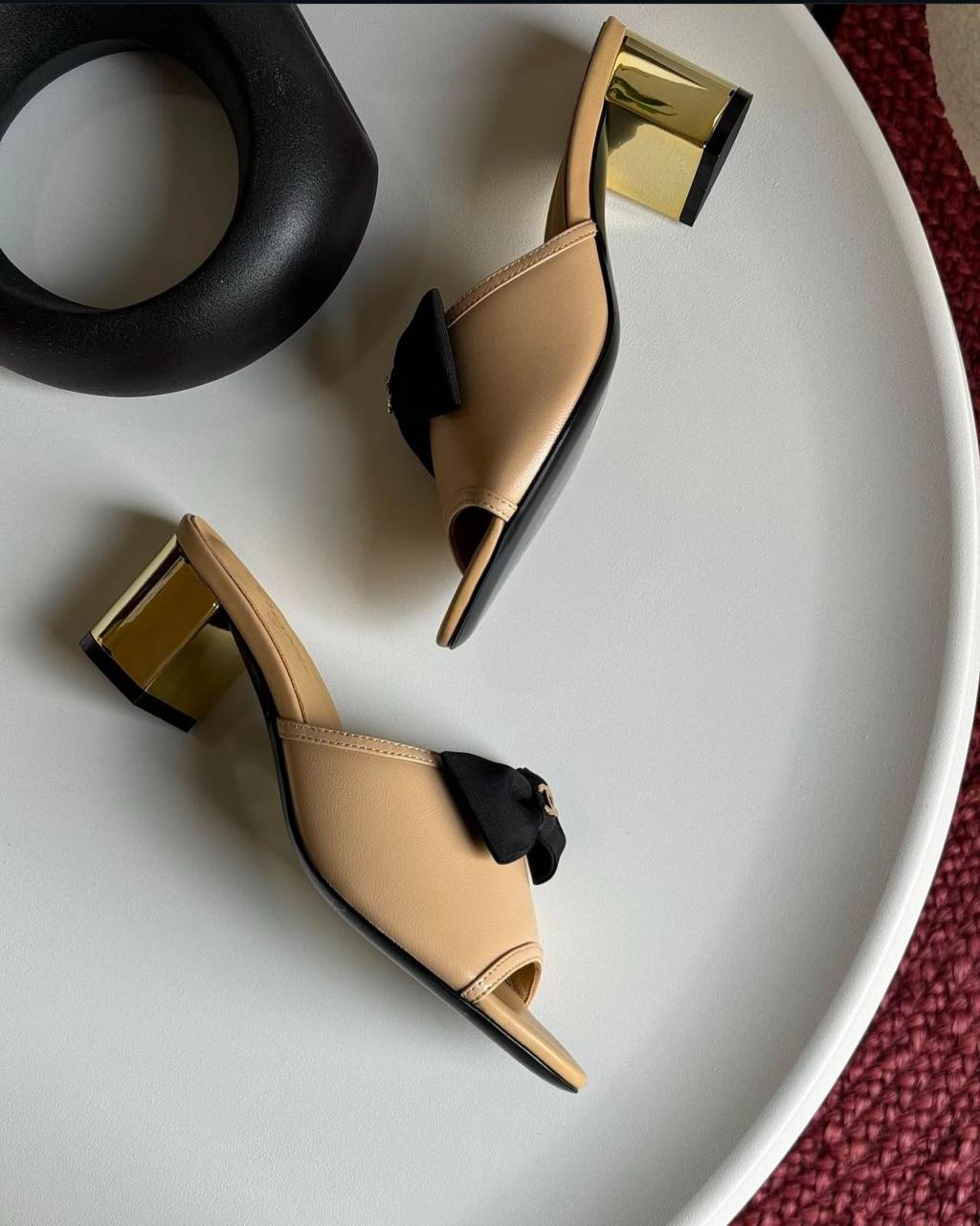 C-h-a-n-e-l bow heel