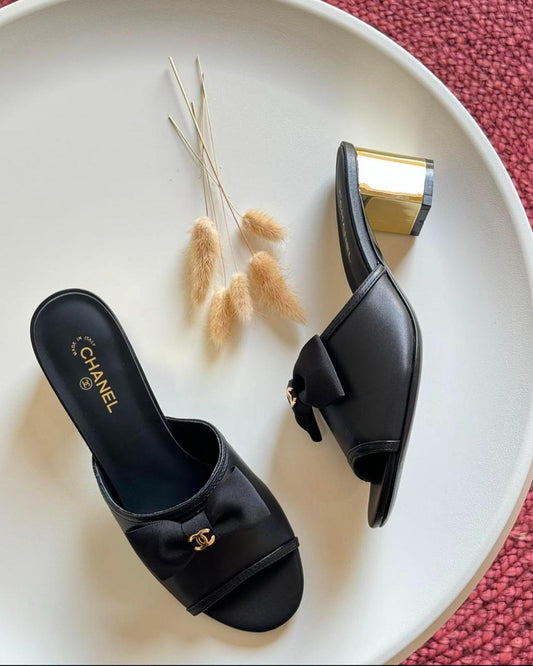 C-h-a-n-e-l bow heel