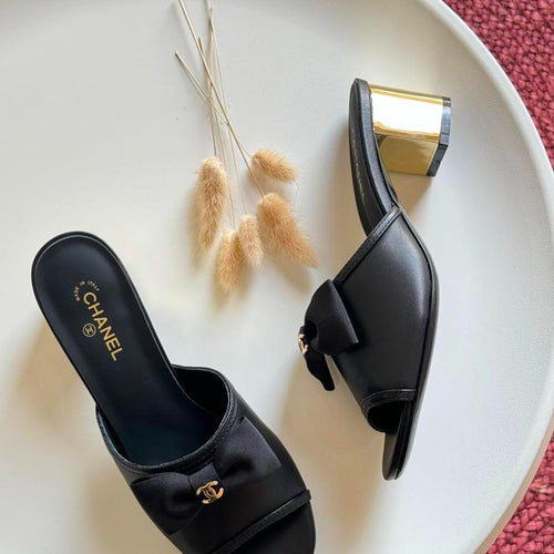 C-h-a-n-e-l bow heel
