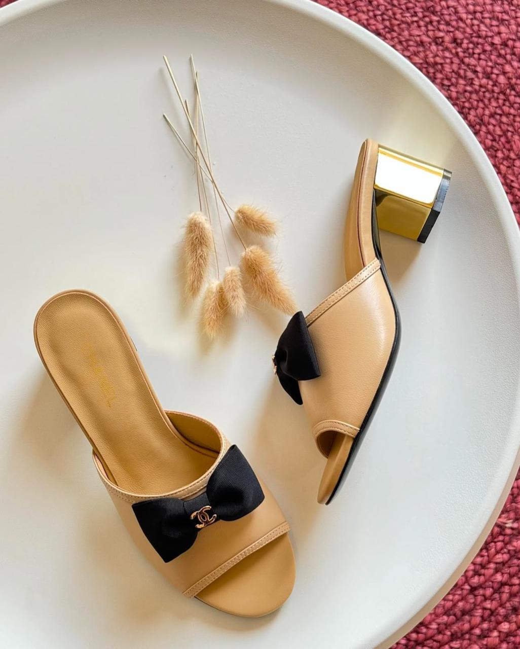 C-h-a-n-e-l bow heel