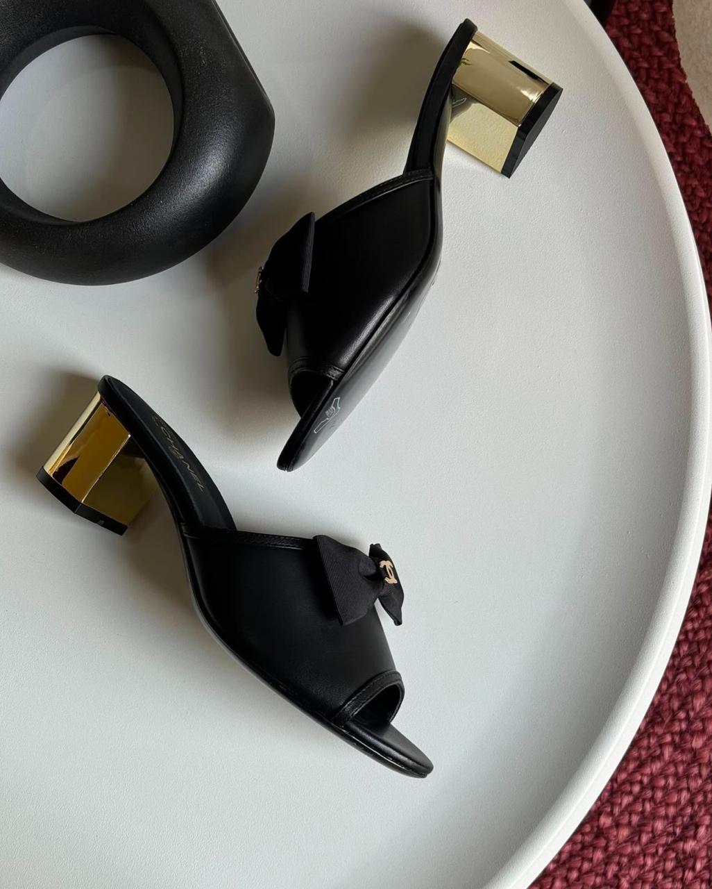C-h-a-n-e-l bow heel