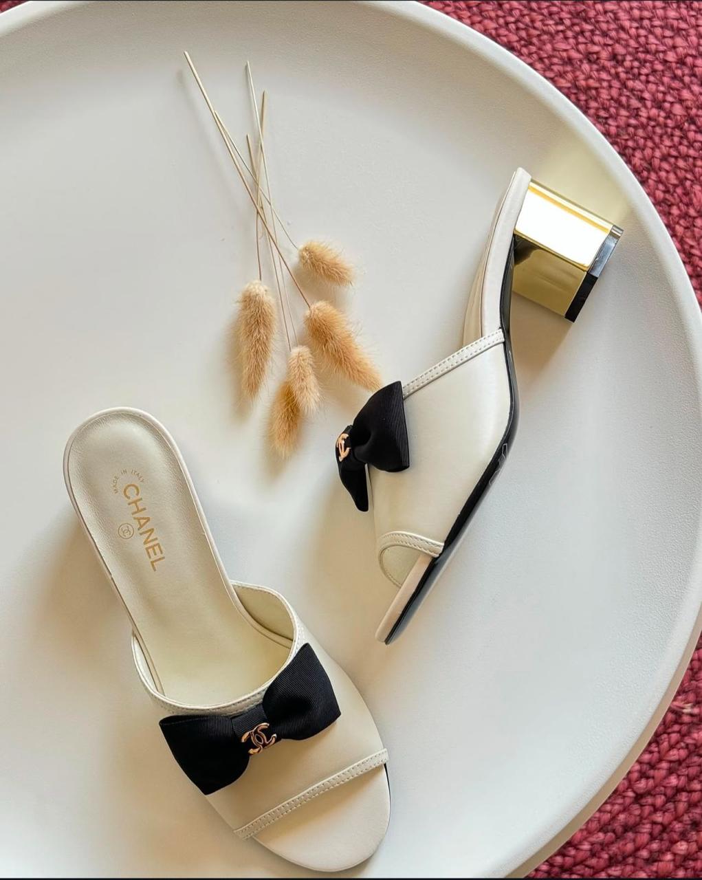 C-h-a-n-e-l bow heel