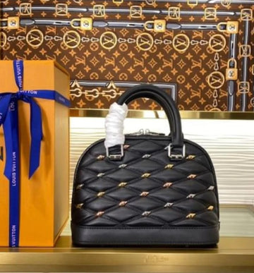 LOUIS VUITTON Alma Studs Tote Bag
