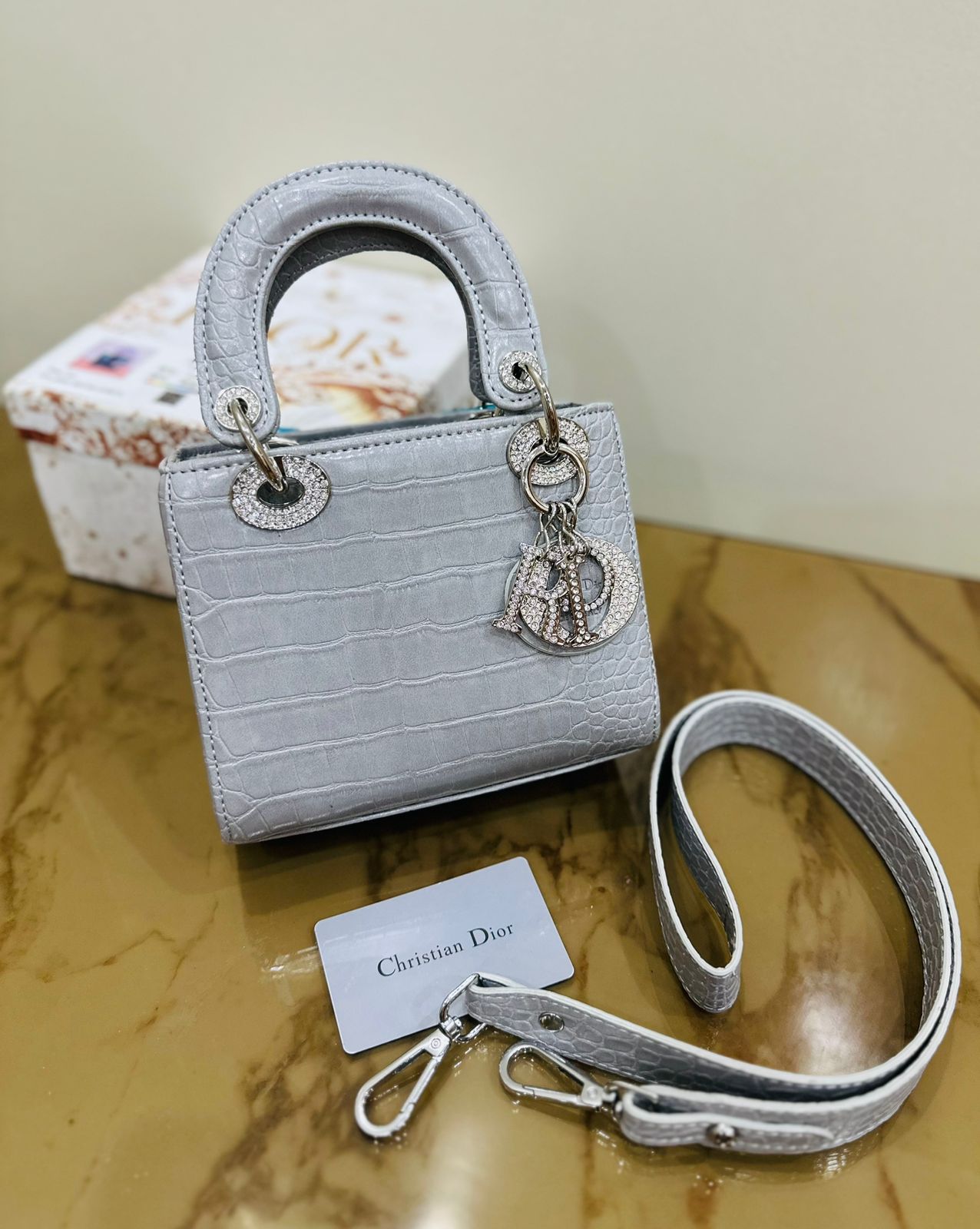 Grey Christian Dior tote bag with structured silhouette and classic cannage pattern