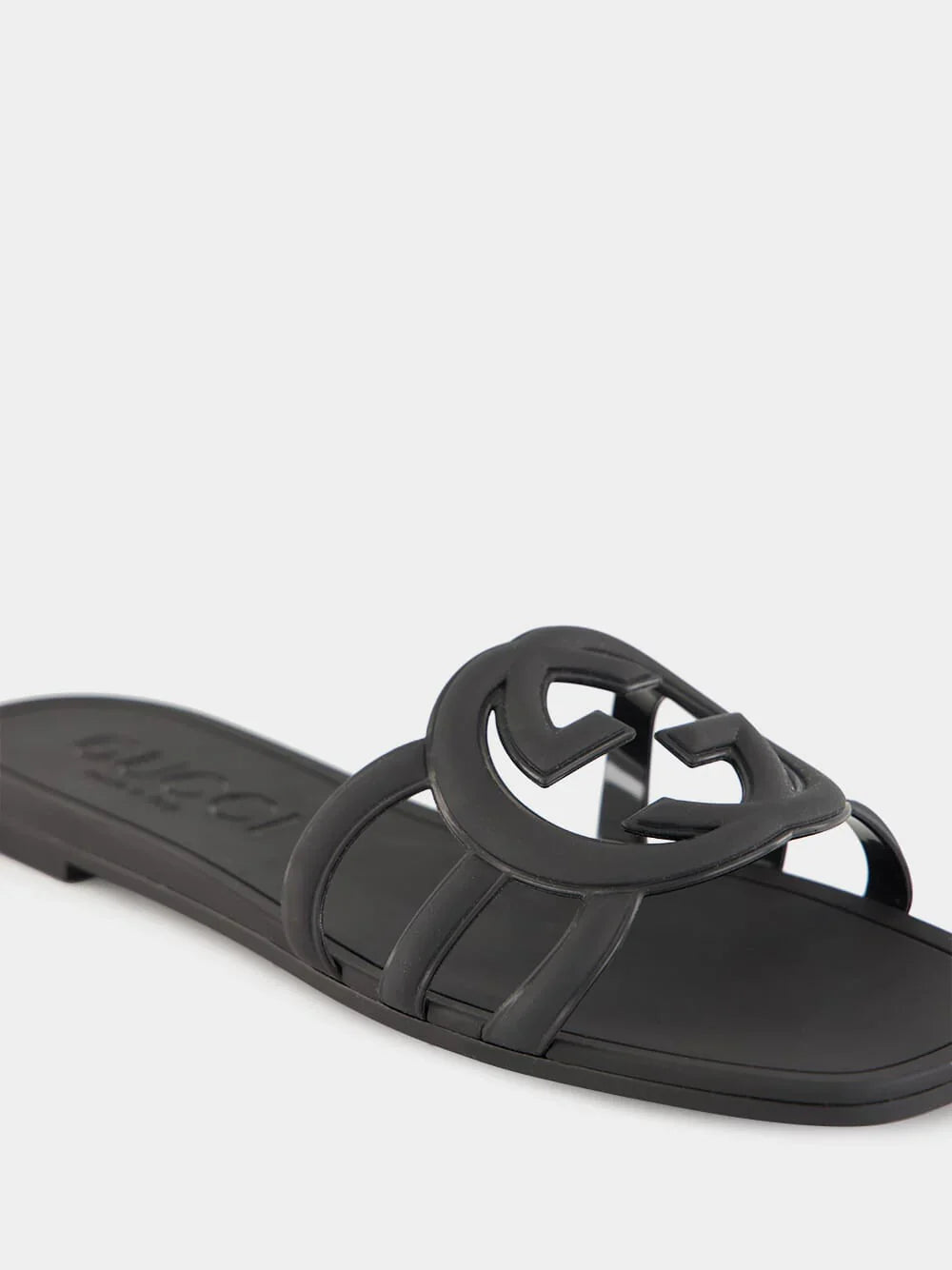 Side view of black Gucci Mystic logo sandals – minimalist and durable slides for everyday designer wear.