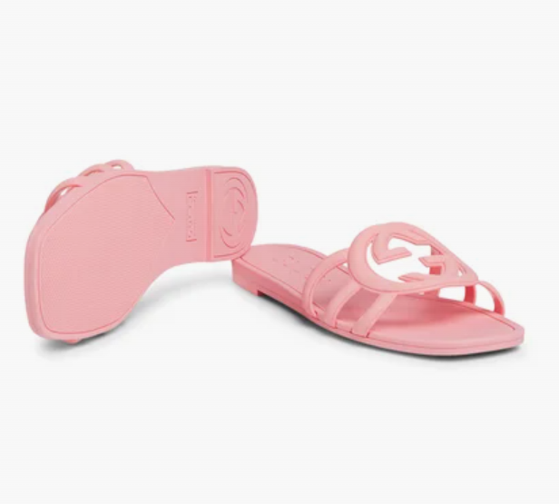 Side angle of pink Gucci Mystic logo slide sandals – luxury slides for women with signature embossed logo strap.