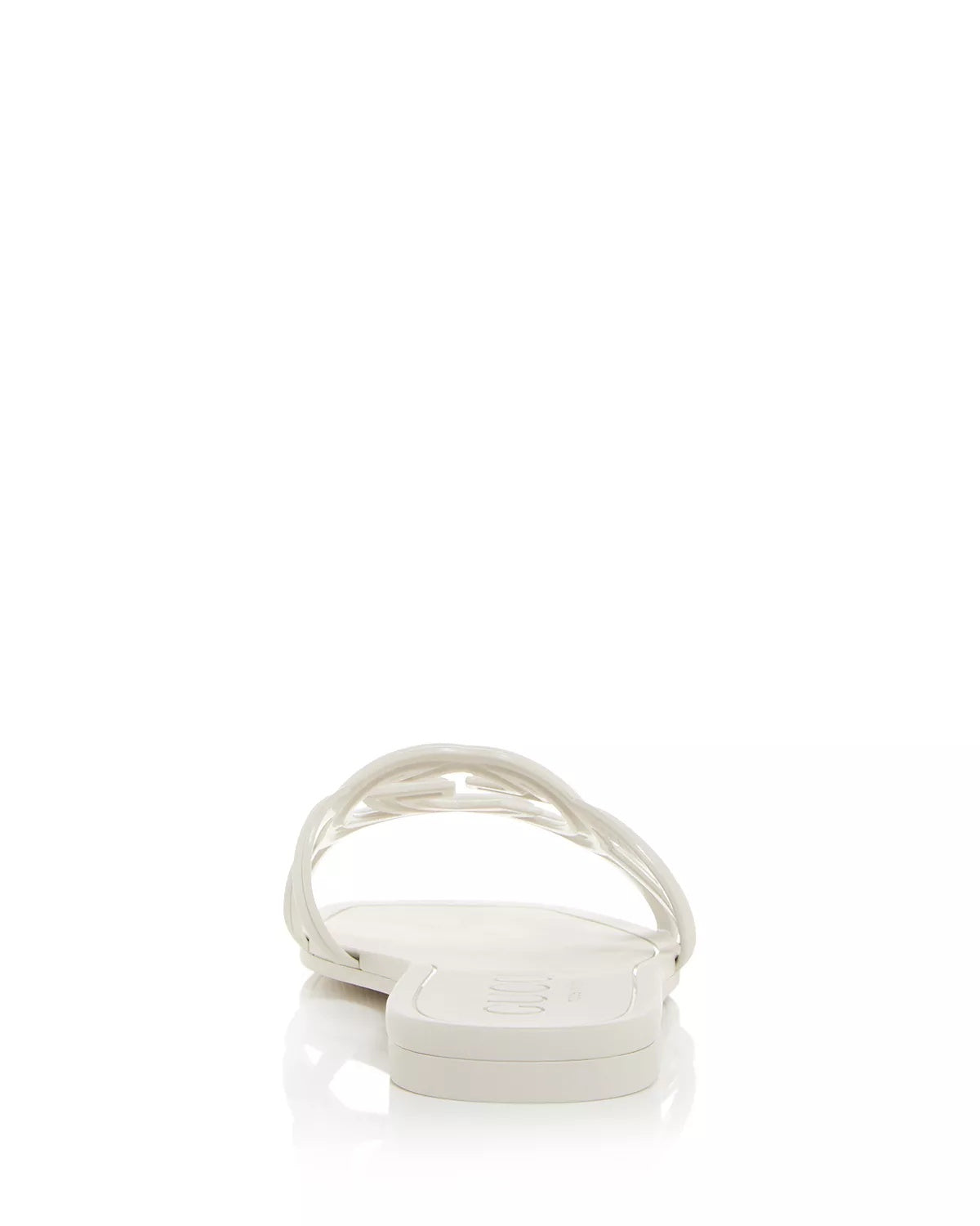 Close-up of white Gucci Mystic logo strap – signature embossed logo on luxury rubber slides for women.