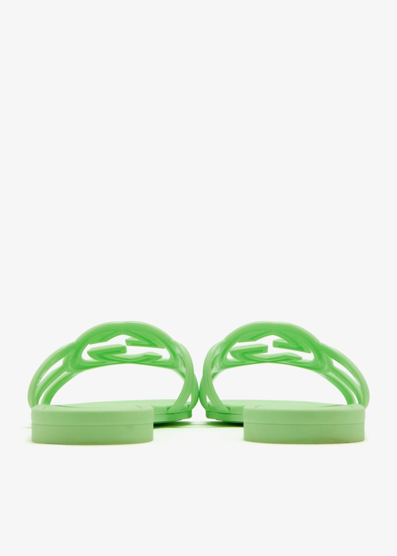 Green Gucci Mystic slides styled by model – trendy women’s summer footwear with comfort and elegance.
