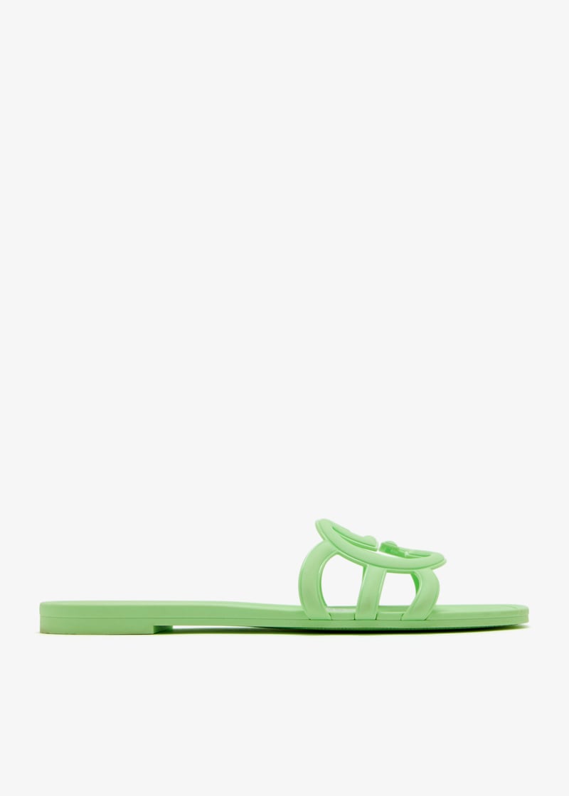 Front view of Gucci women's Mystic logo slide sandals in green – vibrant luxury footwear for casual summer looks.